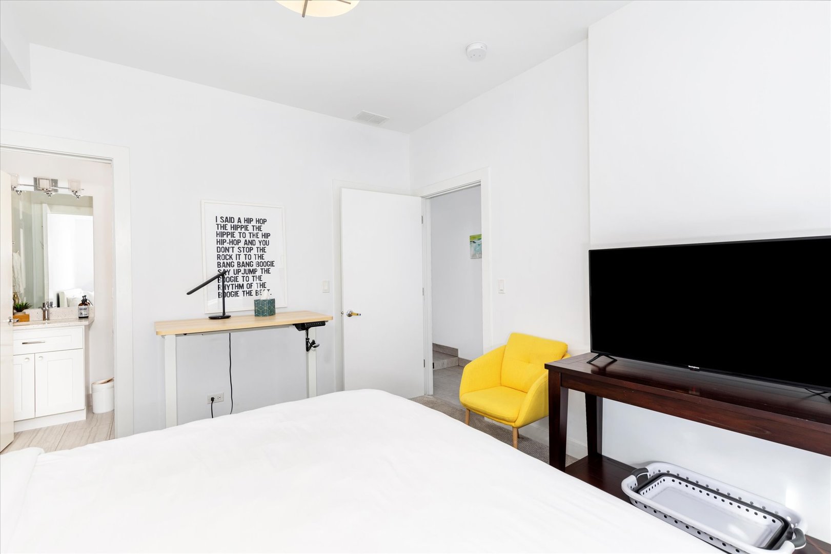 103 Home Avenue Oak Park, IL 60302 - Photo 5 of 33 a bedroom with a bed and a flat screen tv