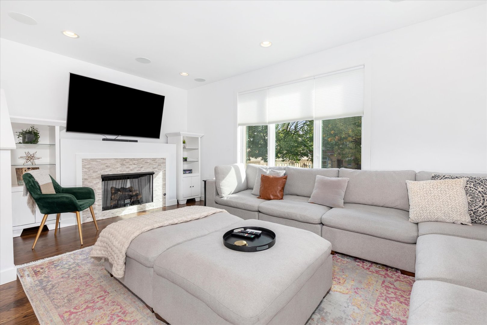 103 Home Avenue Oak Park, IL 60302 - Photo 10 of 33 a living room with furniture a flat screen tv and a fireplace
