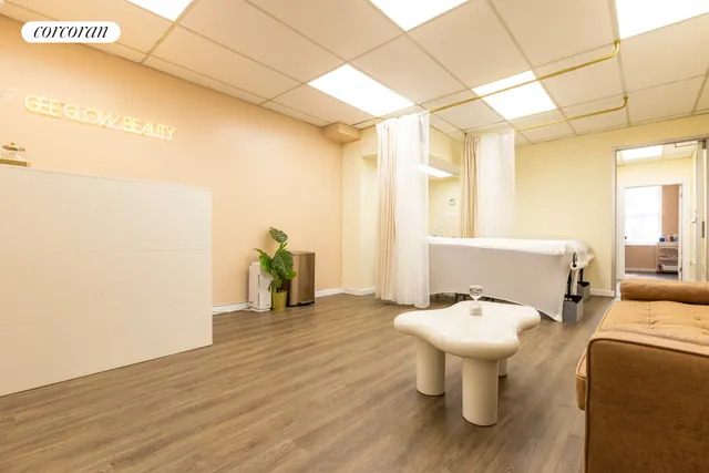a bathroom with a sink and mirror with toilet