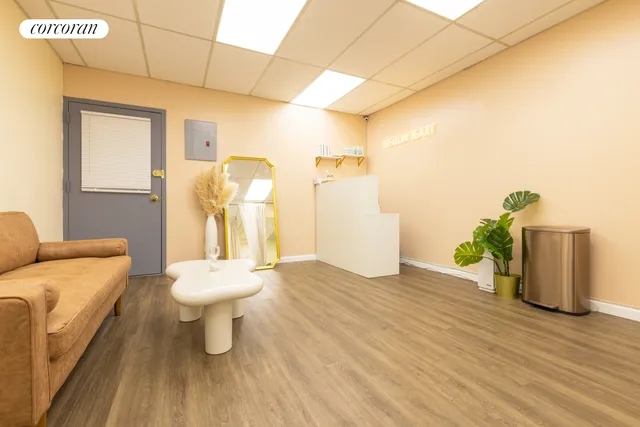 a bathroom with a toilet and a mirror