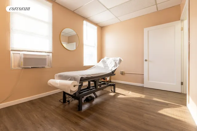 a room with wooden floor and a window