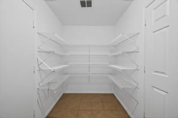 a view of an empty walk in closet
