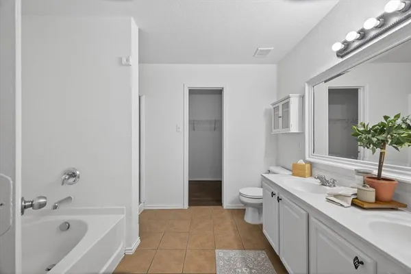 a bathroom with a bathtub and shower