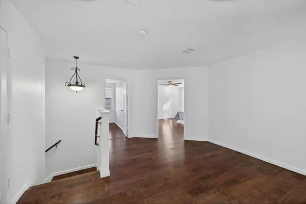 a bathroom with a double vanity sink toilet mirror and bathtub