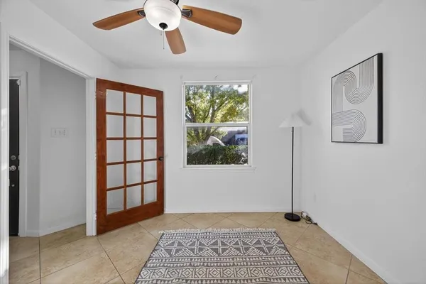 a view of an empty room with a window