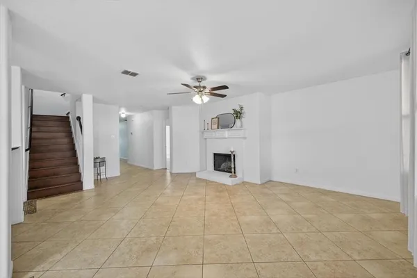 a view of an empty room with a fireplace