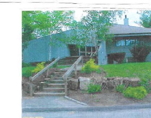 1 Kiwi Corner, Unit 1 Ridgefield, CT 06877 - Photo 1 of 1 a front view of a house with garden
