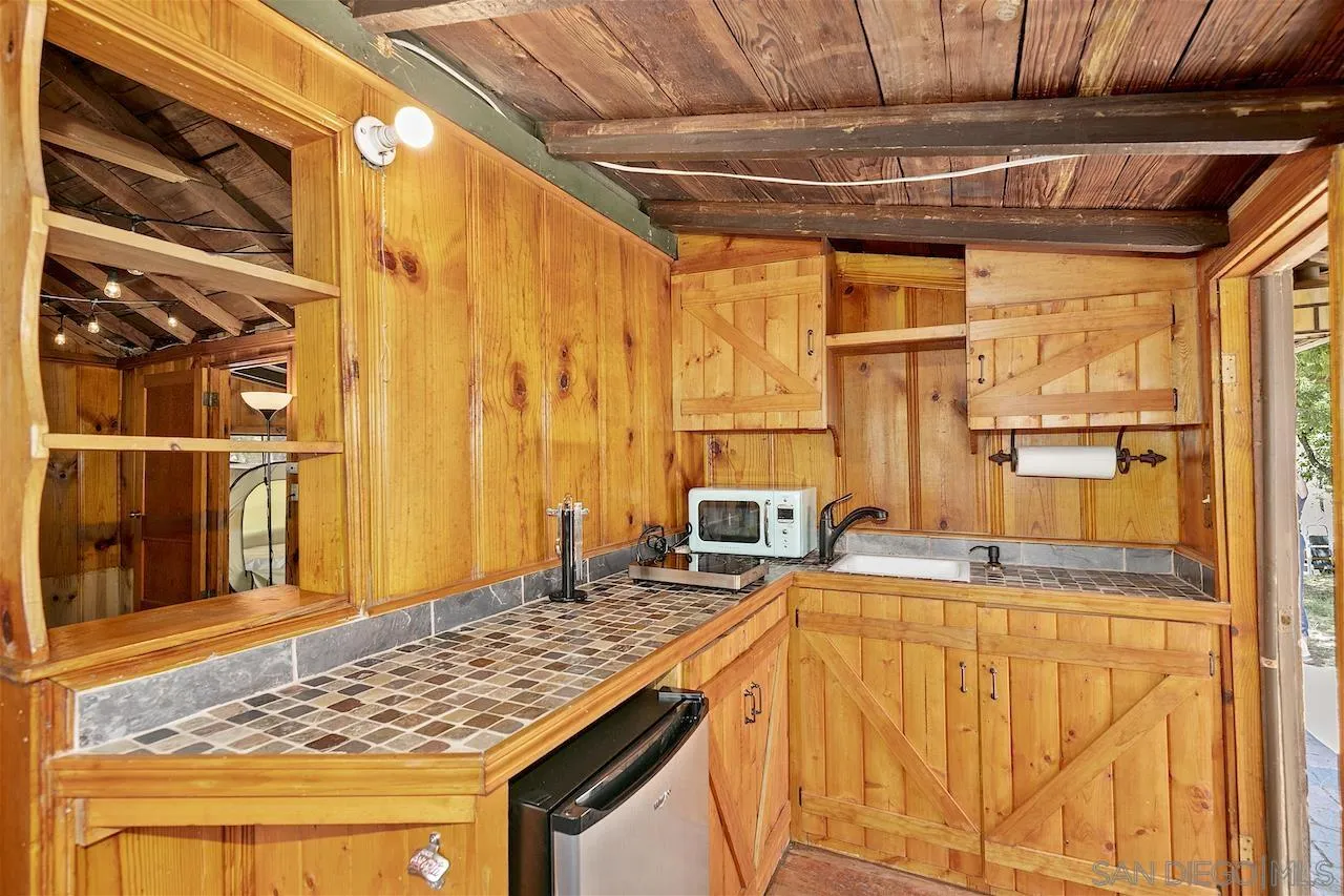 509 El Centro Terrace Mount Laguna, CA 91948 - Photo 6 of 23 a bed room with a bed and a table