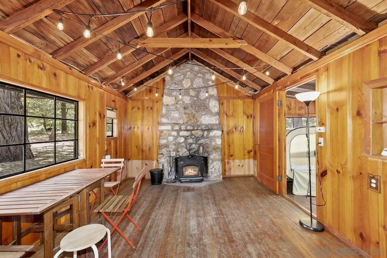 509 El Centro Terrace Mount Laguna, CA 91948 - Photo 9 of 23 a living room with furniture a fireplace and wooden floor