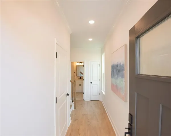 a view of a bathroom from a hallway