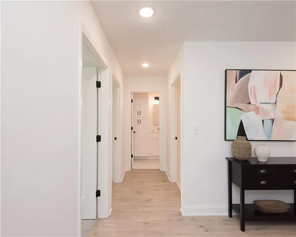 a view of hallway with furniture