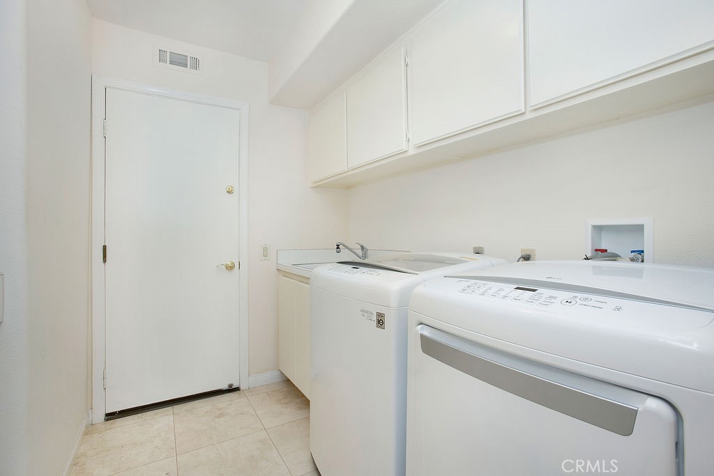 22 Callender Court Laguna Niguel, CA 92677 - Photo 26 of 67 a utility room with dryer and washer