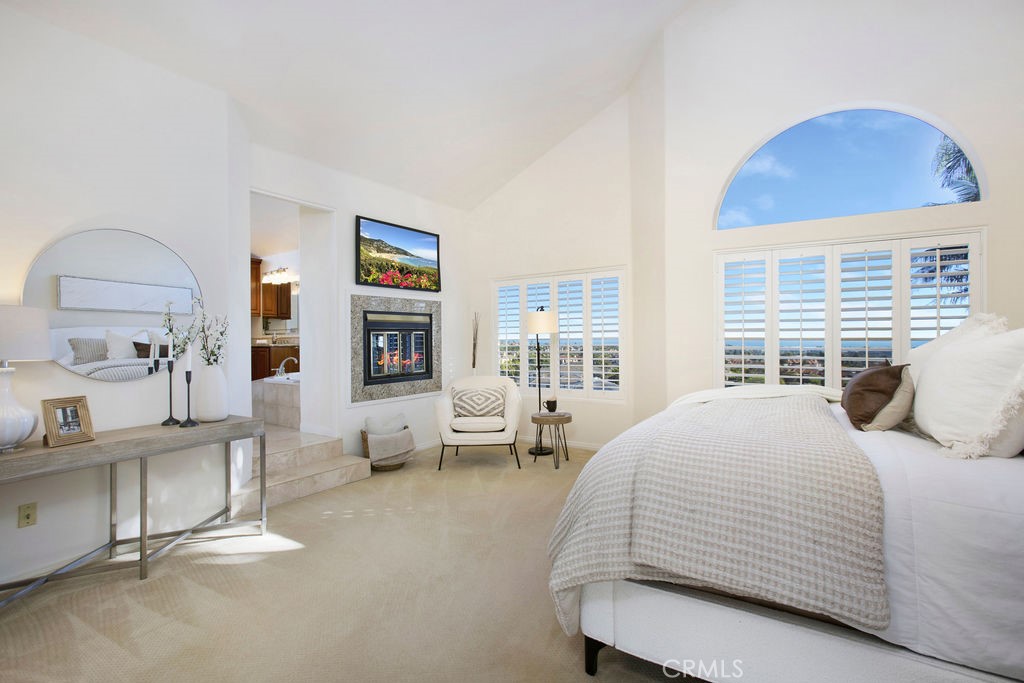 22 Callender Court Laguna Niguel, CA 92677 - Photo 27 of 67 a bedroom with a bed and wooden floor