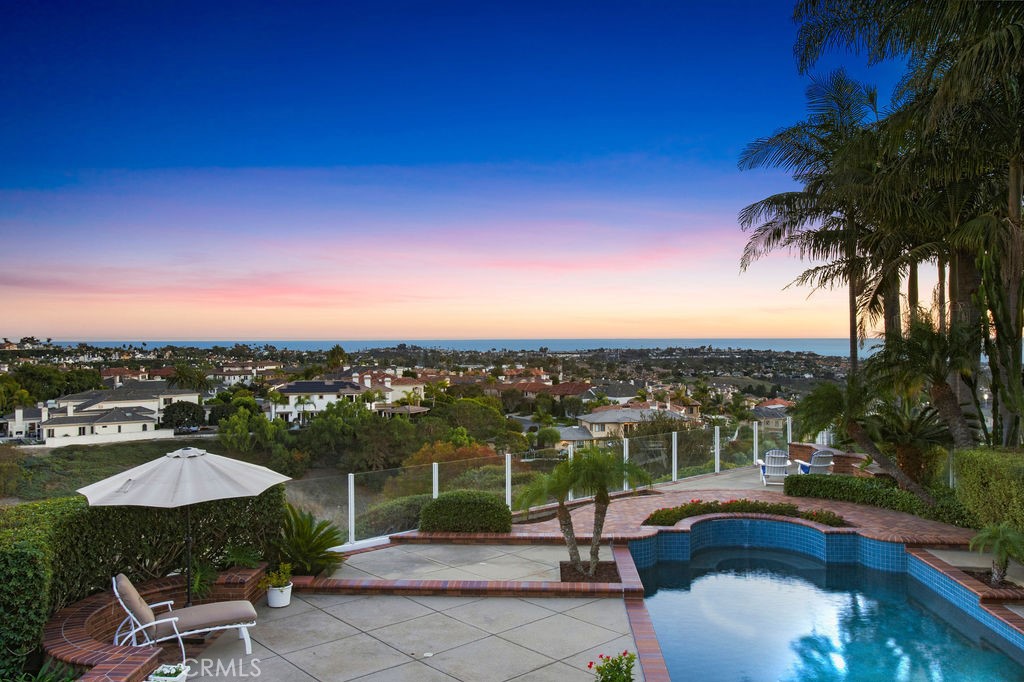 22 Callender Court Laguna Niguel, CA 92677 - Photo 3 of 67 a view of a swimming pool and lounge chairs