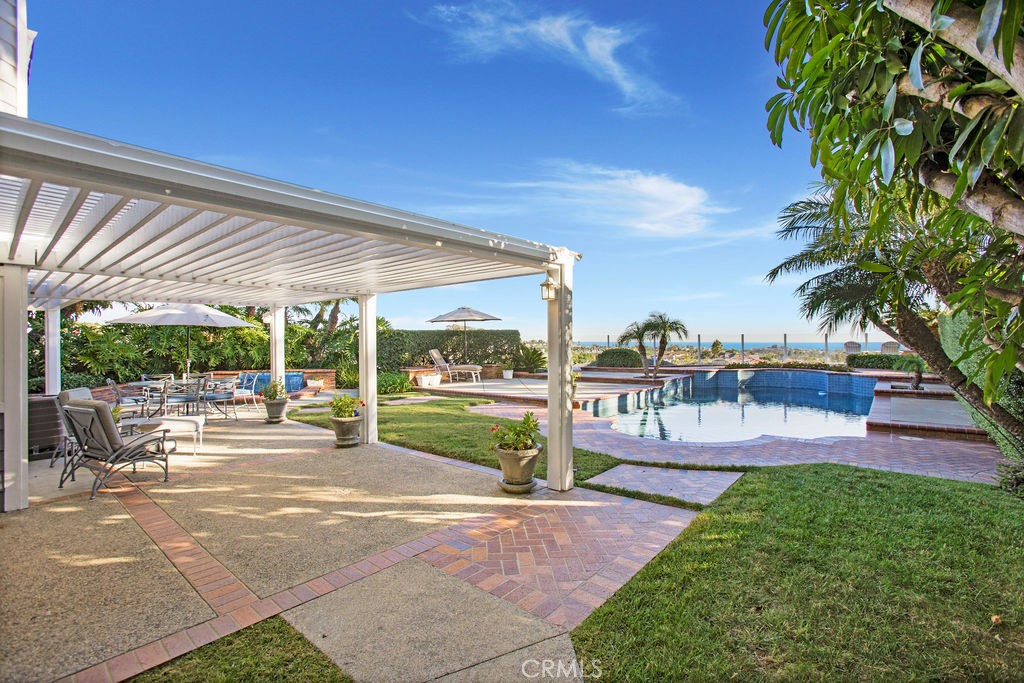 22 Callender Court Laguna Niguel, CA 92677 - Photo 42 of 67 a view of a swimming pool with a patio