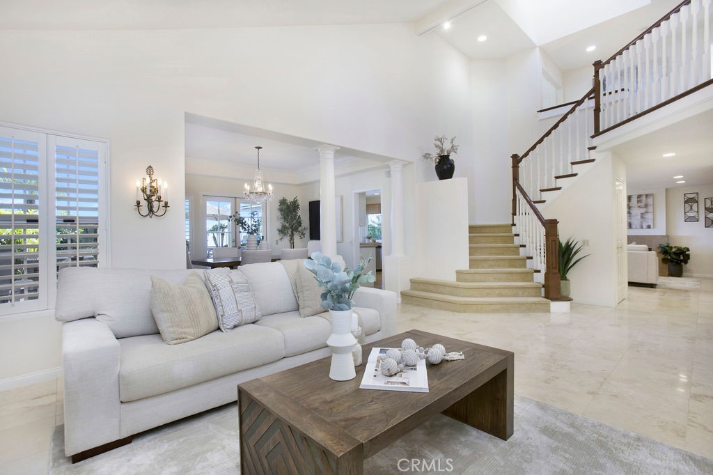 22 Callender Court Laguna Niguel, CA 92677 - Photo 8 of 67 a living room with furniture and a dining table with wooden floor