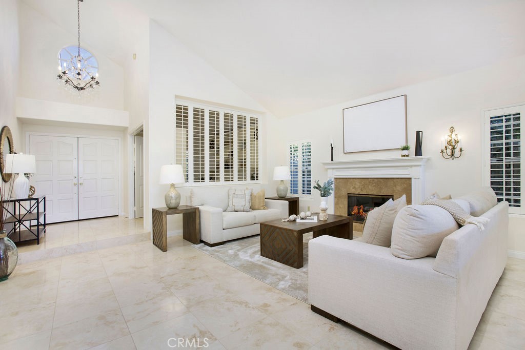 22 Callender Court Laguna Niguel, CA 92677 - Photo 9 of 67 a living room with furniture and a fireplace