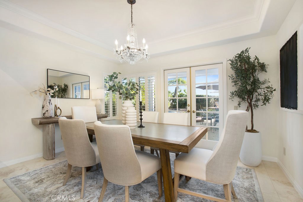 22 Callender Court Laguna Niguel, CA 92677 - Photo 10 of 67 a dining room with furniture a chandelier and wooden floor