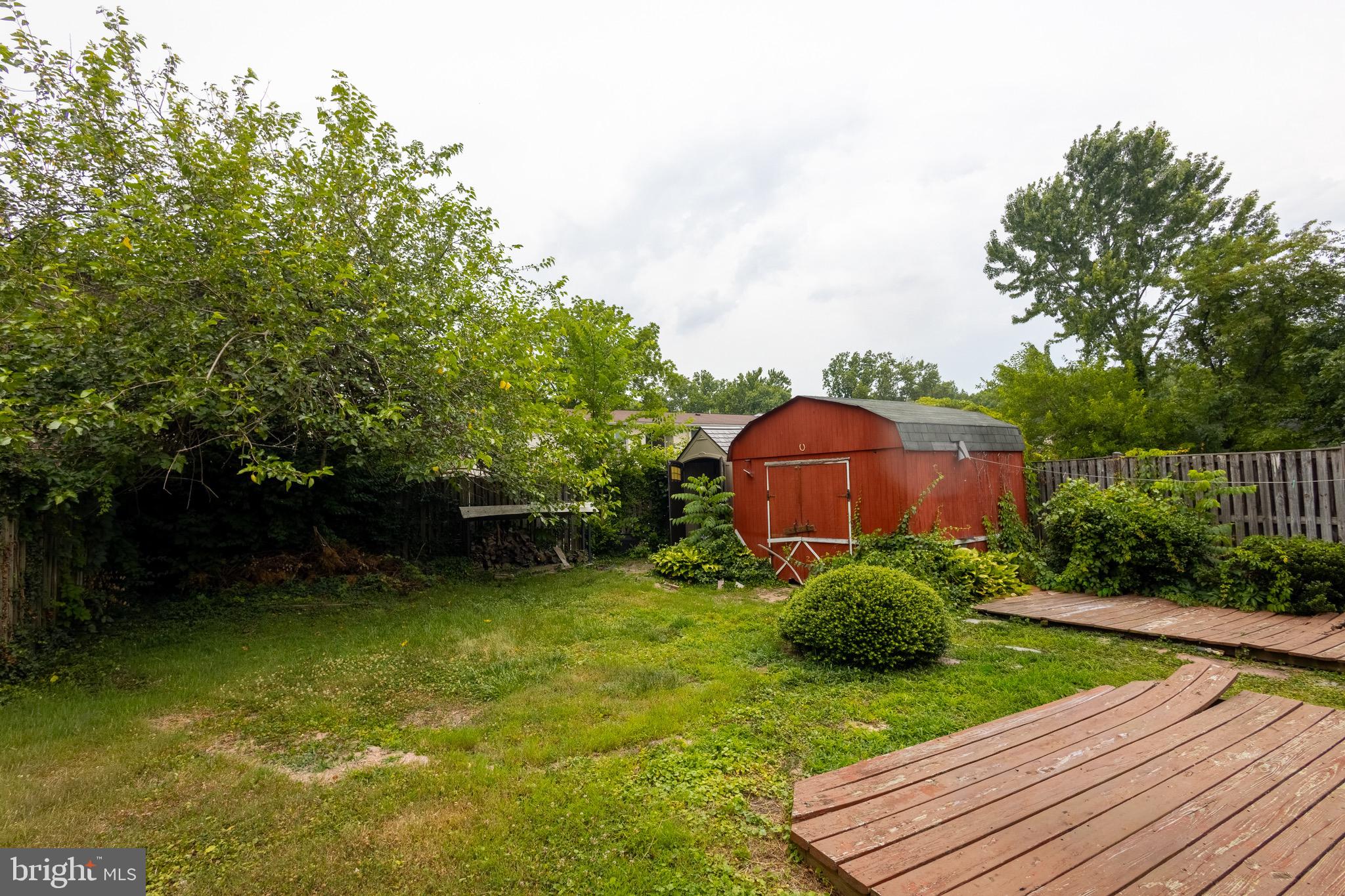 37 4th Street Laurel, MD 20707 - Photo 20 of 26 a view of a backyard with plants and a patio