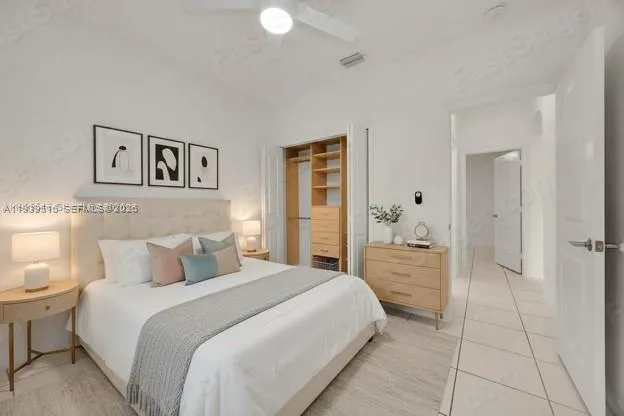 a bedroom with a bed and a view of bathroom