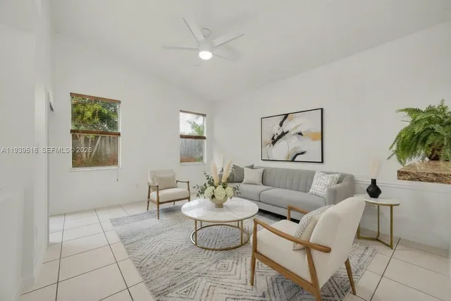 a living room with furniture and white walls