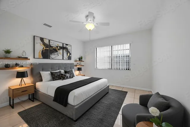 a bedroom with bed and a window