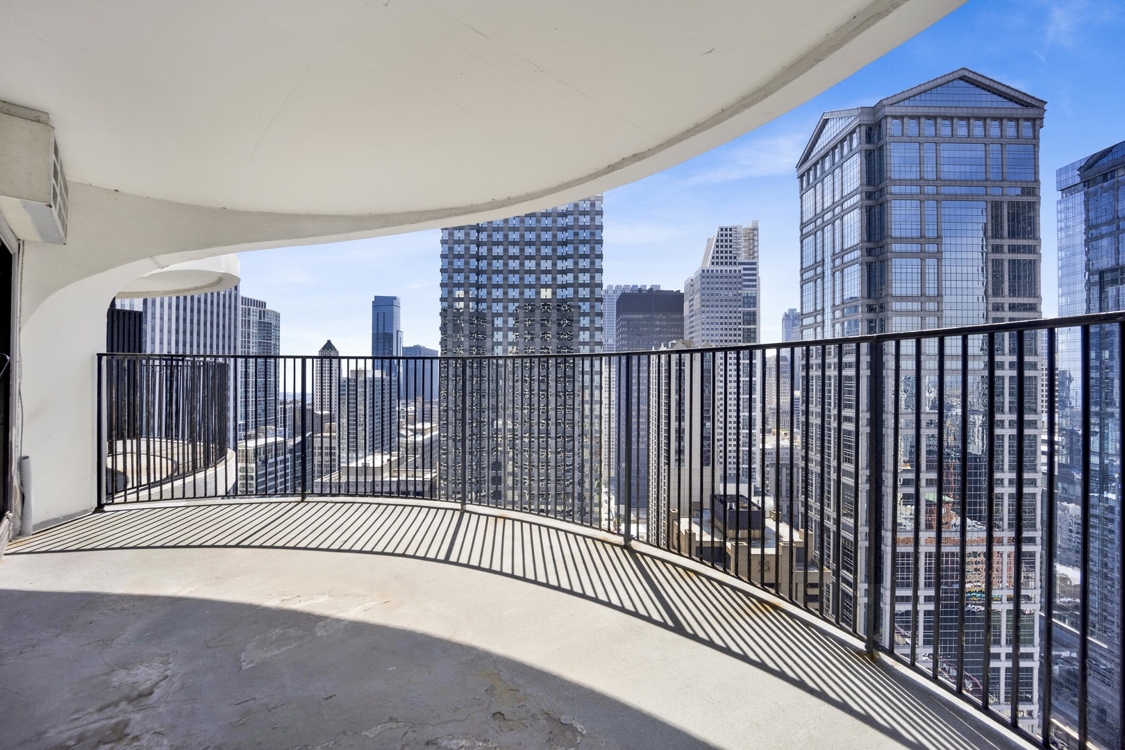 300 North State Street, Unit 4512 Chicago, IL 60654 - Photo 15 of 20 a view of balcony with a floor to ceiling window and wooden floor