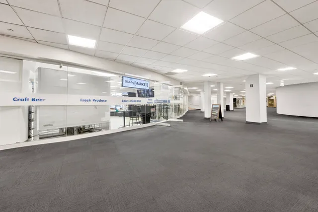 a view of counter top space with wooden floor