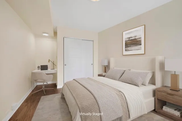 a bedroom with a bed and a lamp