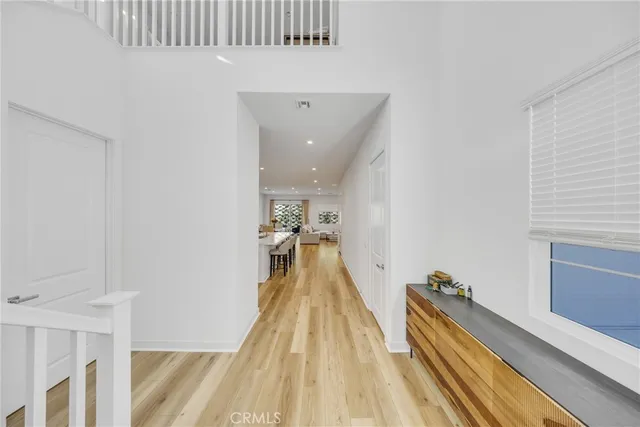 a view of a room with wooden floor