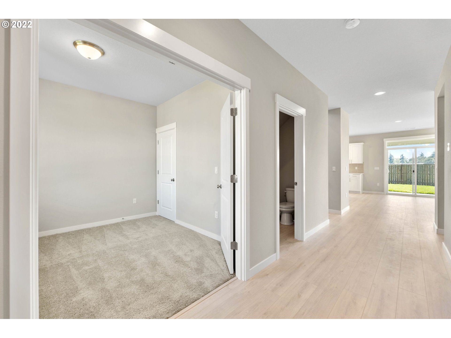 8836 North 3rd Circle Ridgefield, WA 98642 - Photo 3 of 32 a view of a hallway with wooden floor