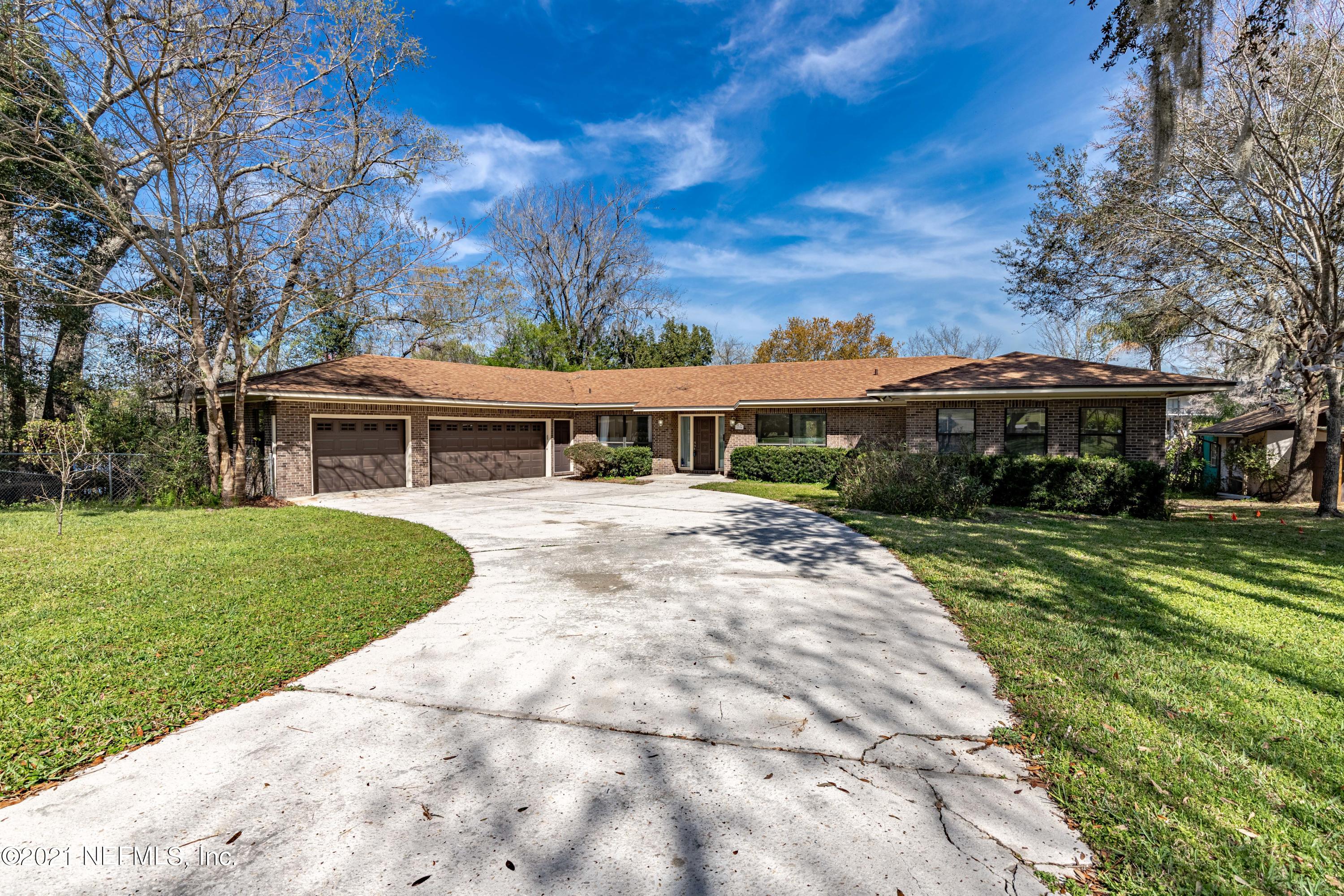 1704 Memory Lane Jacksonville, FL 32210 - Photo 1 of 54 a front view of house with a garden