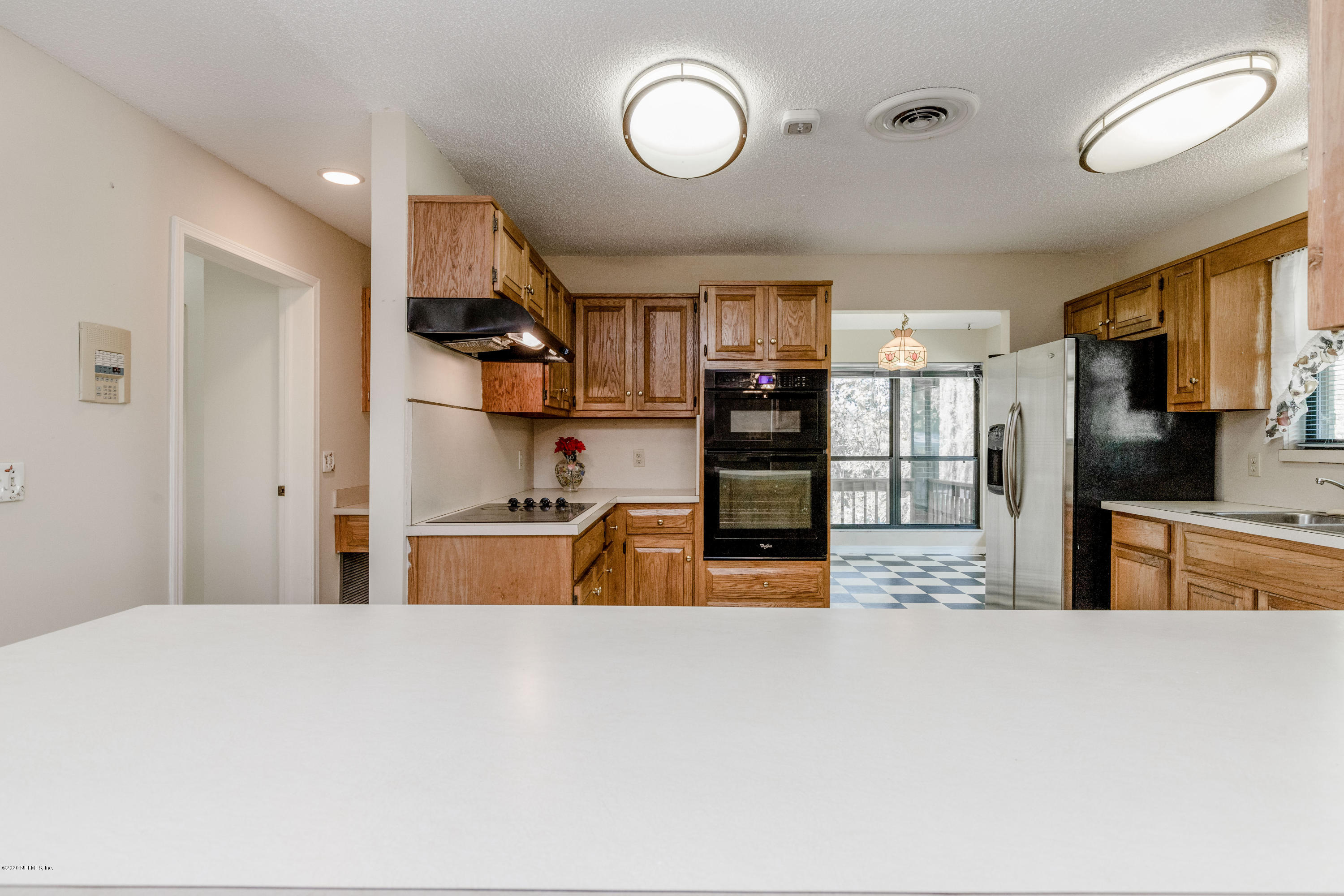 1704 Memory Lane Jacksonville, FL 32210 - Photo 13 of 54 a large kitchen with stainless steel appliances granite countertop a refrigerator and a sink