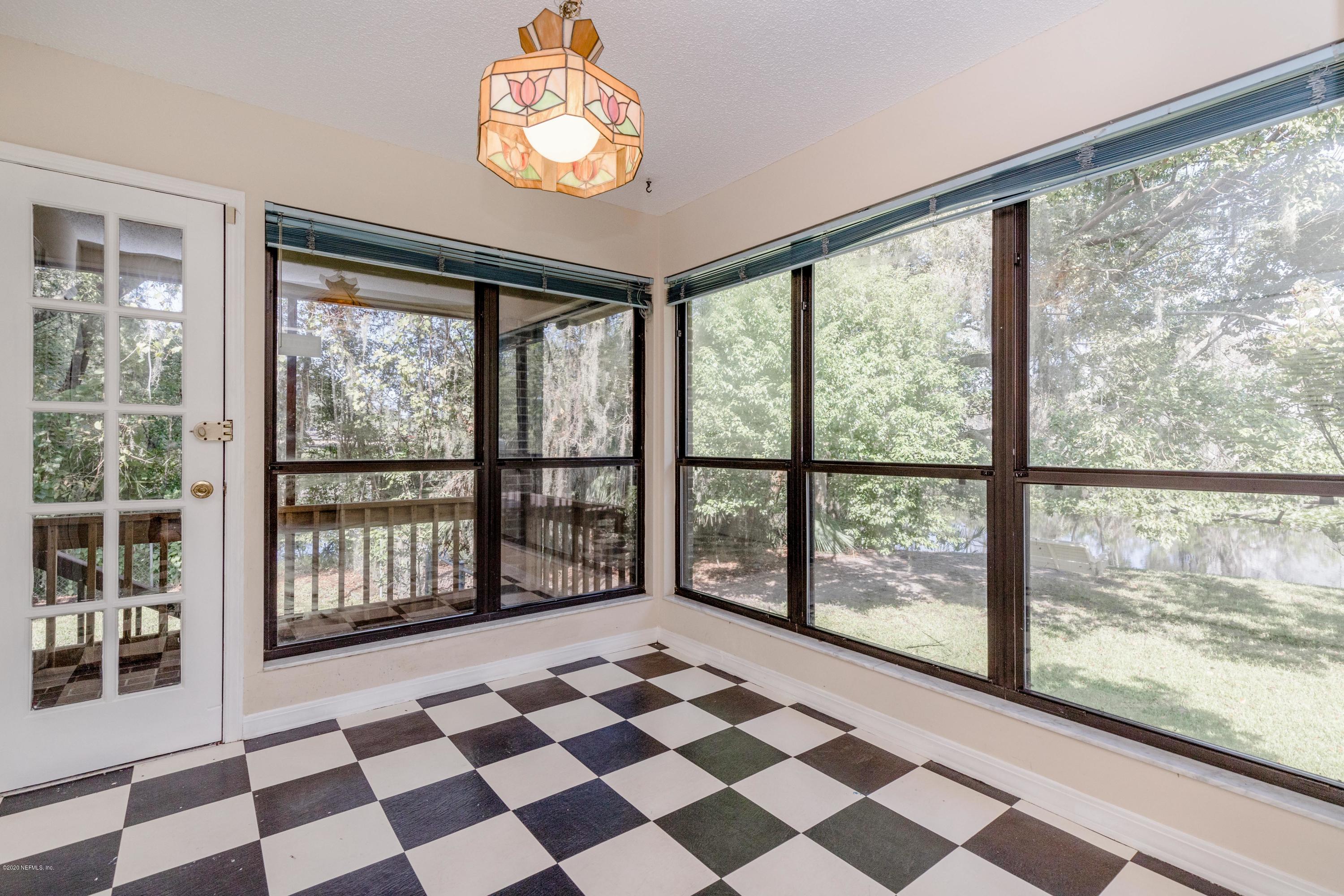 1704 Memory Lane Jacksonville, FL 32210 - Photo 14 of 54 a view of a large window with a black and white checkered floor