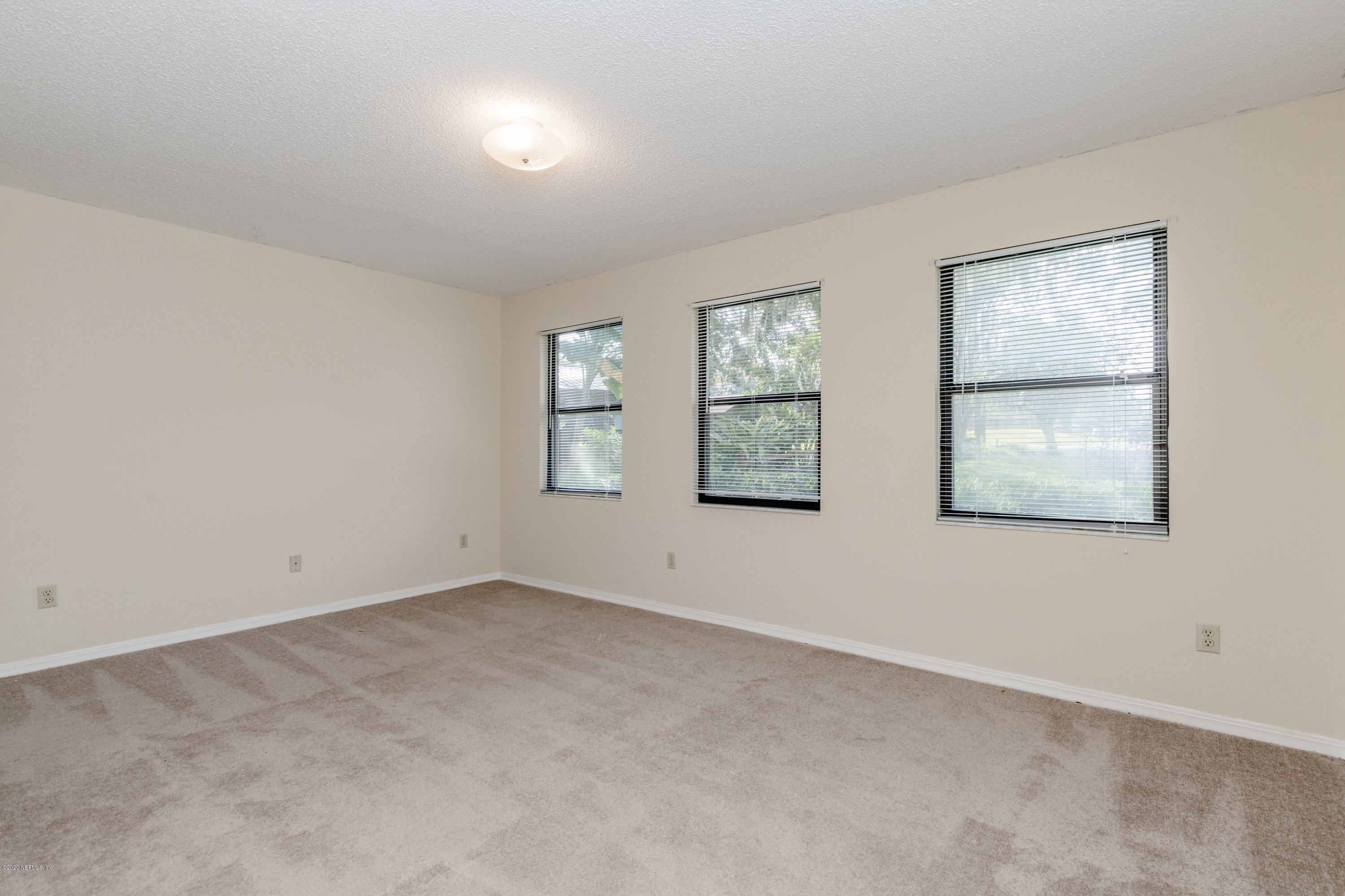 1704 Memory Lane Jacksonville, FL 32210 - Photo 22 of 54 an empty room with windows