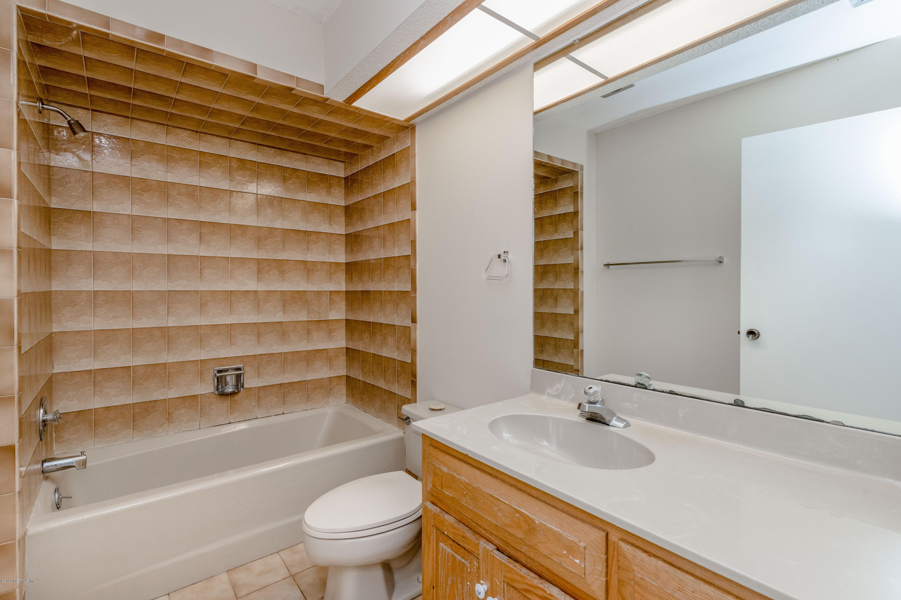 1704 Memory Lane Jacksonville, FL 32210 - Photo 24 of 54 a bathroom with a sink toilet and shower