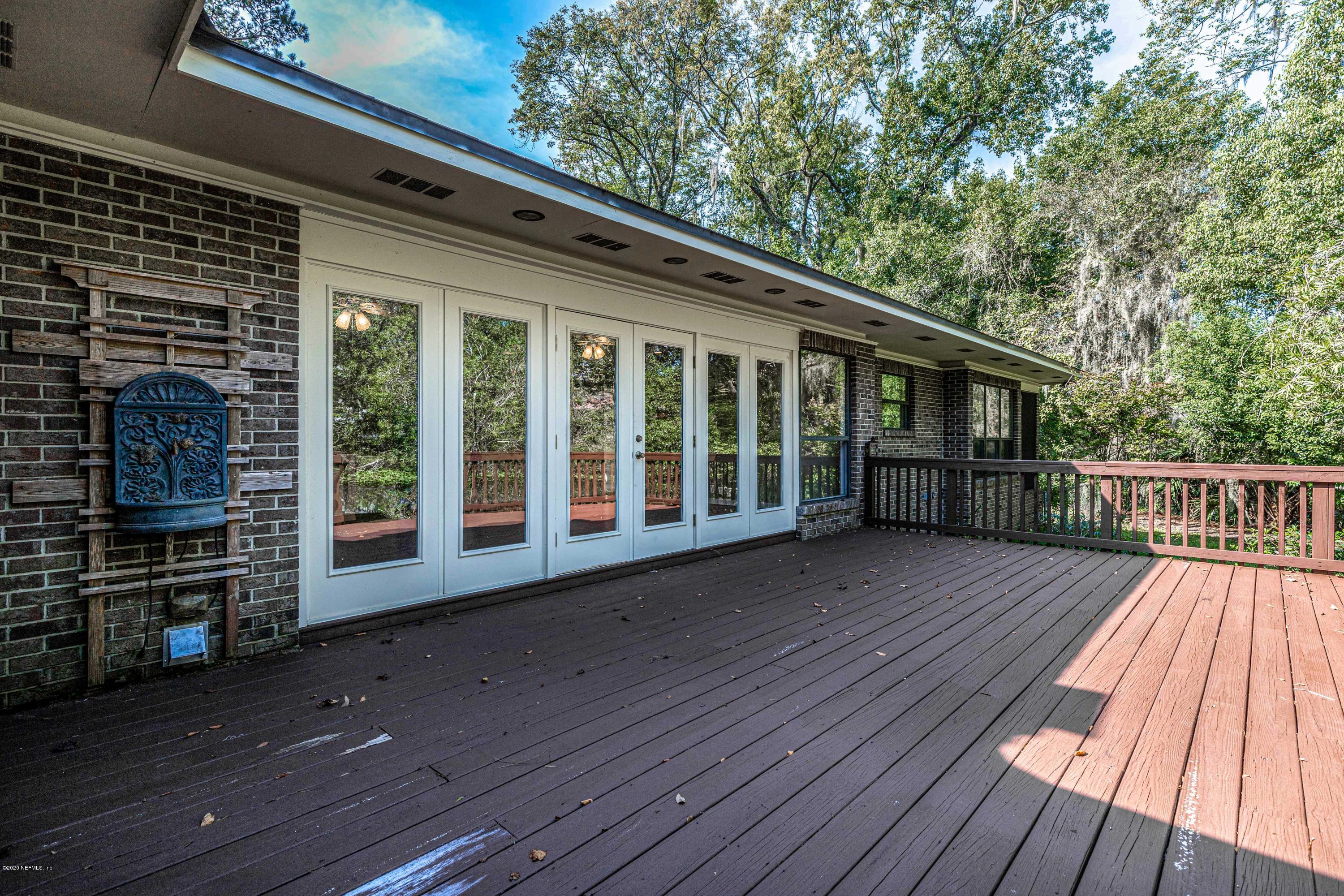 1704 Memory Lane Jacksonville, FL 32210 - Photo 26 of 54 a view of backyard with deck and wooden floor