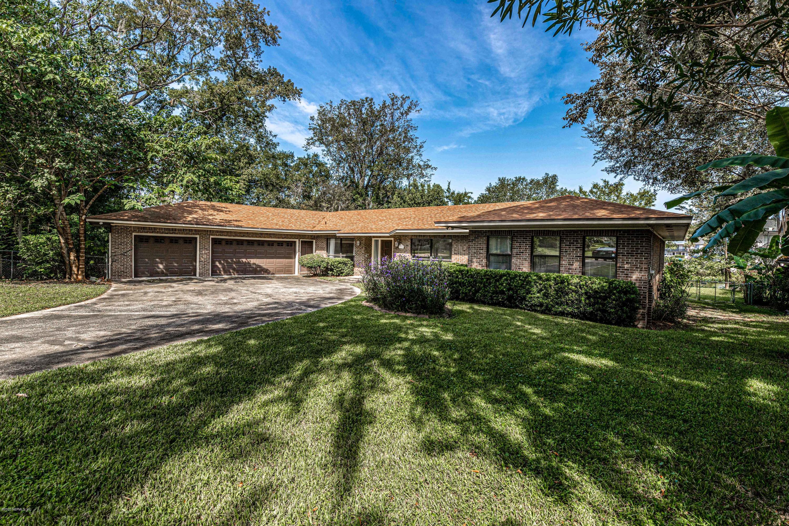 1704 Memory Lane Jacksonville, FL 32210 - Photo 36 of 54 a view of a house with a yard