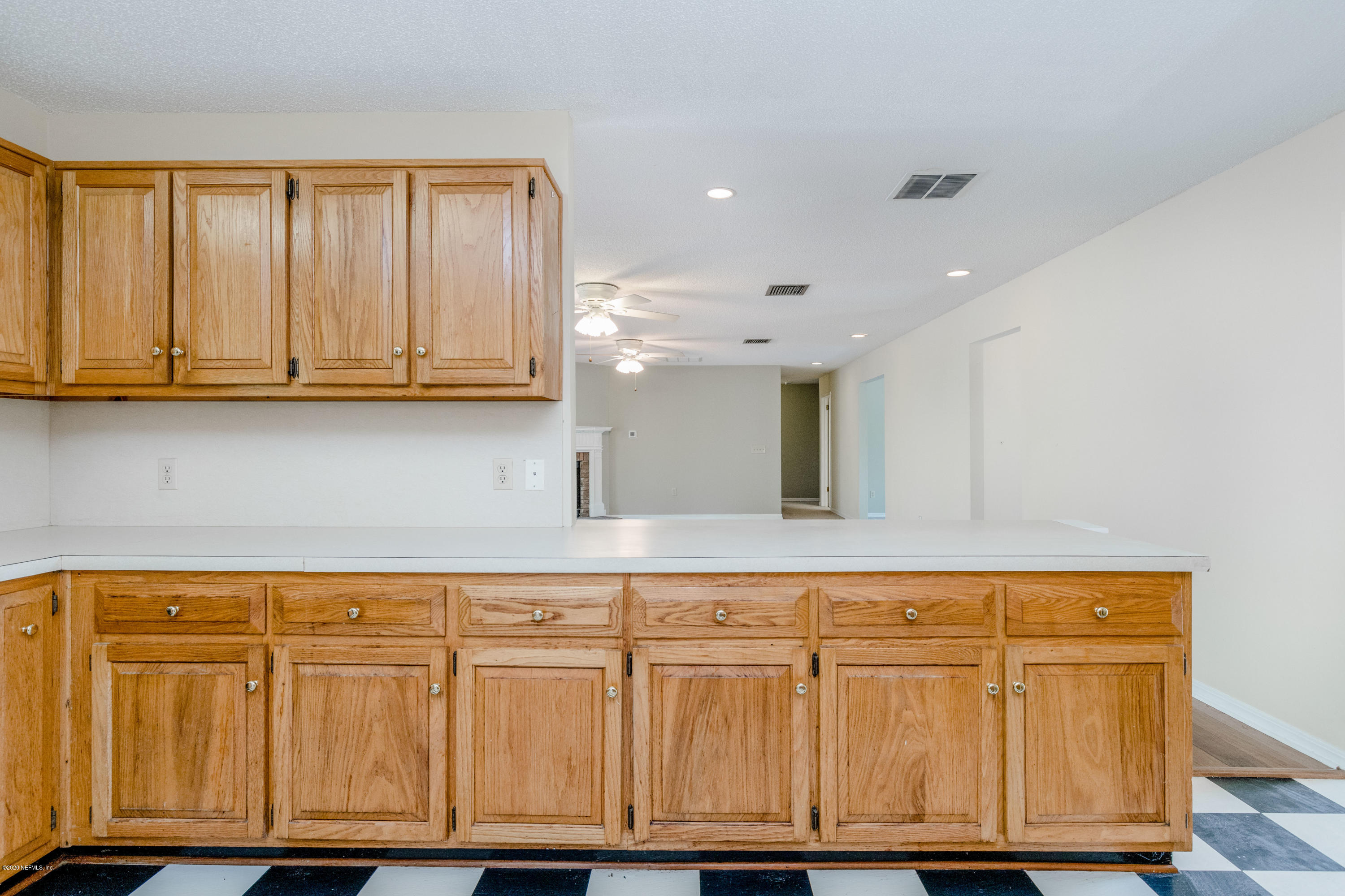 1704 Memory Lane Jacksonville, FL 32210 - Photo 37 of 54 a view of kitchen with wooden cabinets