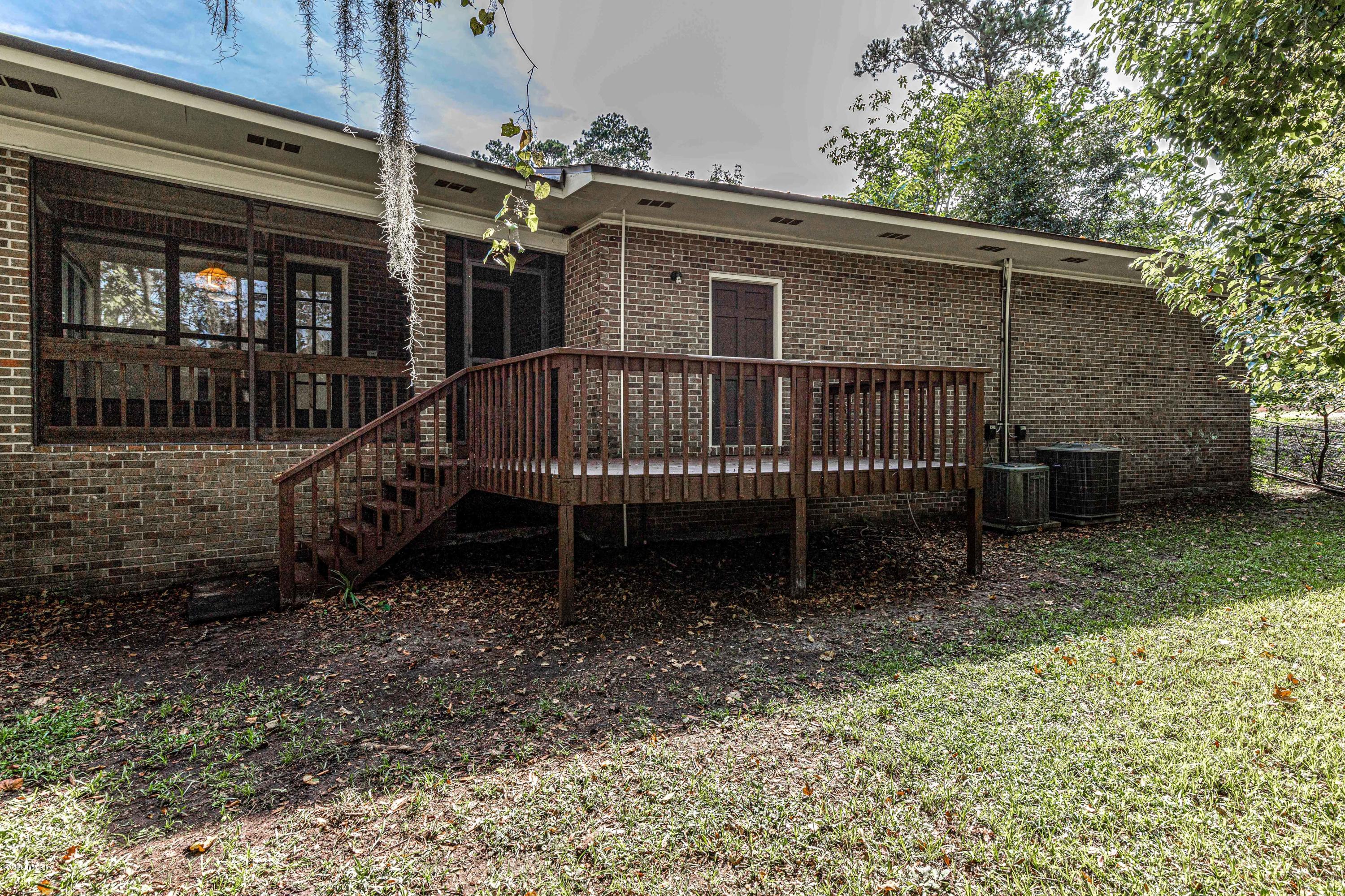1704 Memory Lane Jacksonville, FL 32210 - Photo 44 of 54 front view of a house with a yard