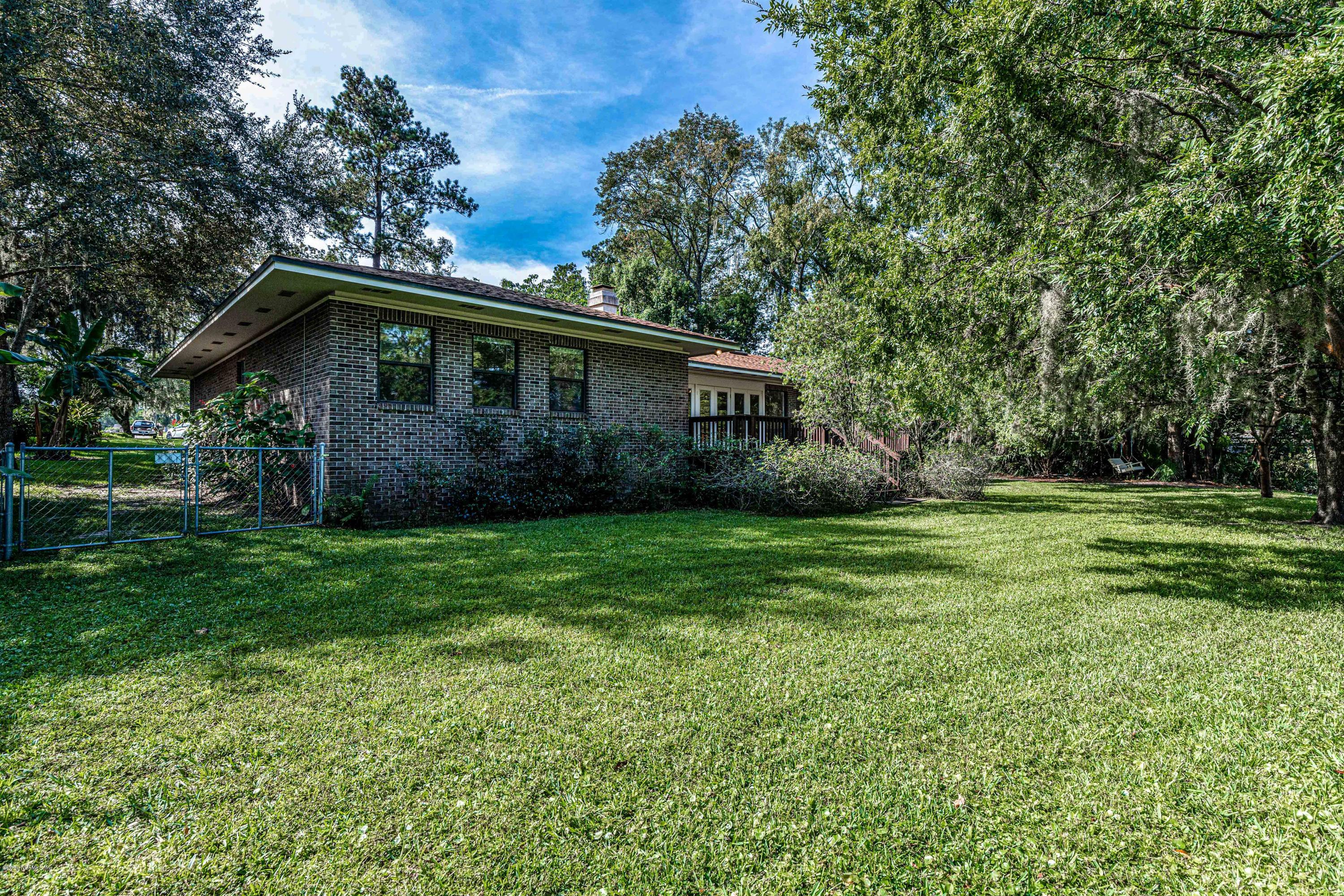 1704 Memory Lane Jacksonville, FL 32210 - Photo 46 of 54 a view of a house with a yard