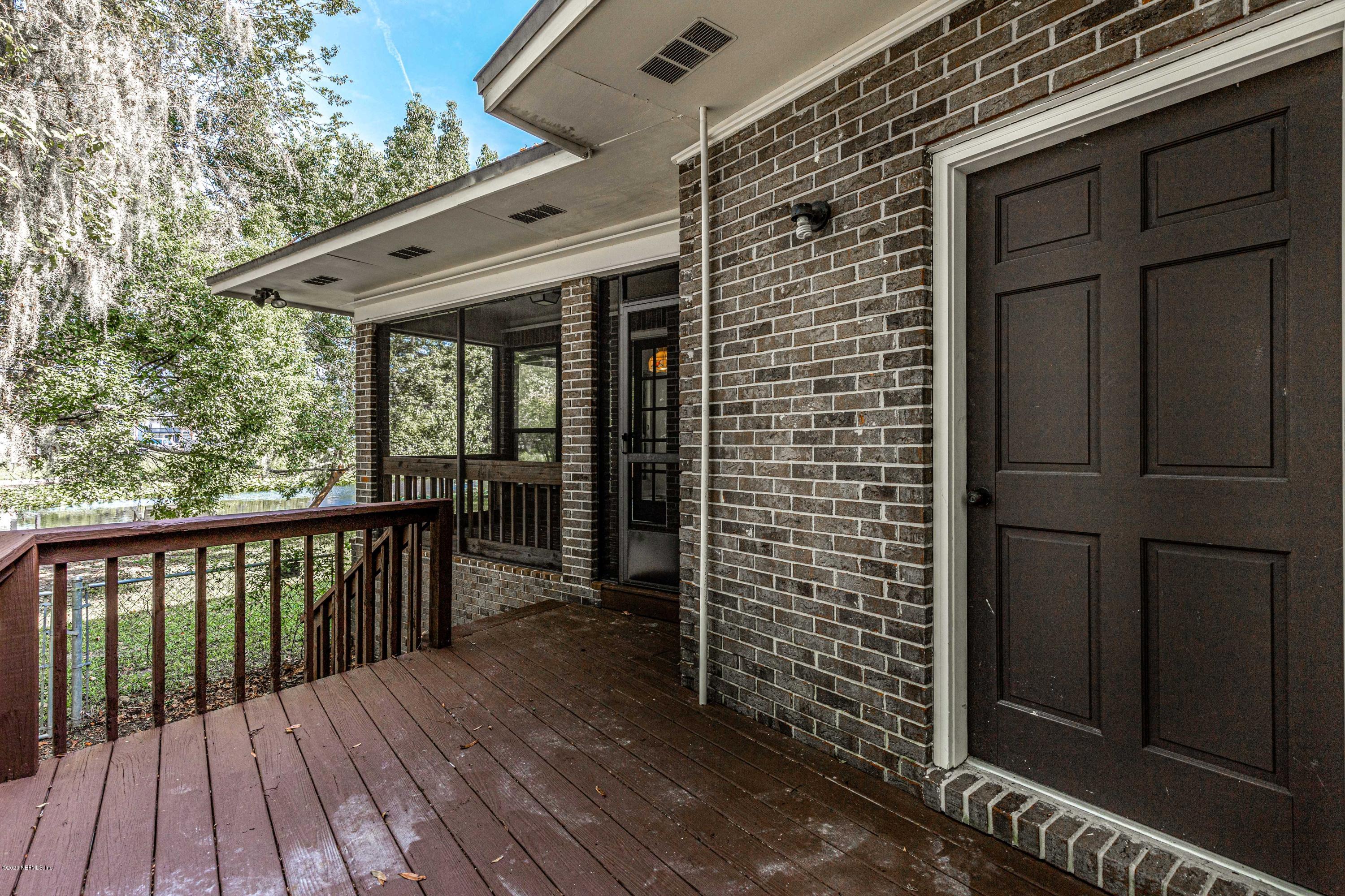 1704 Memory Lane Jacksonville, FL 32210 - Photo 49 of 54 a view of a balcony with wooden floor