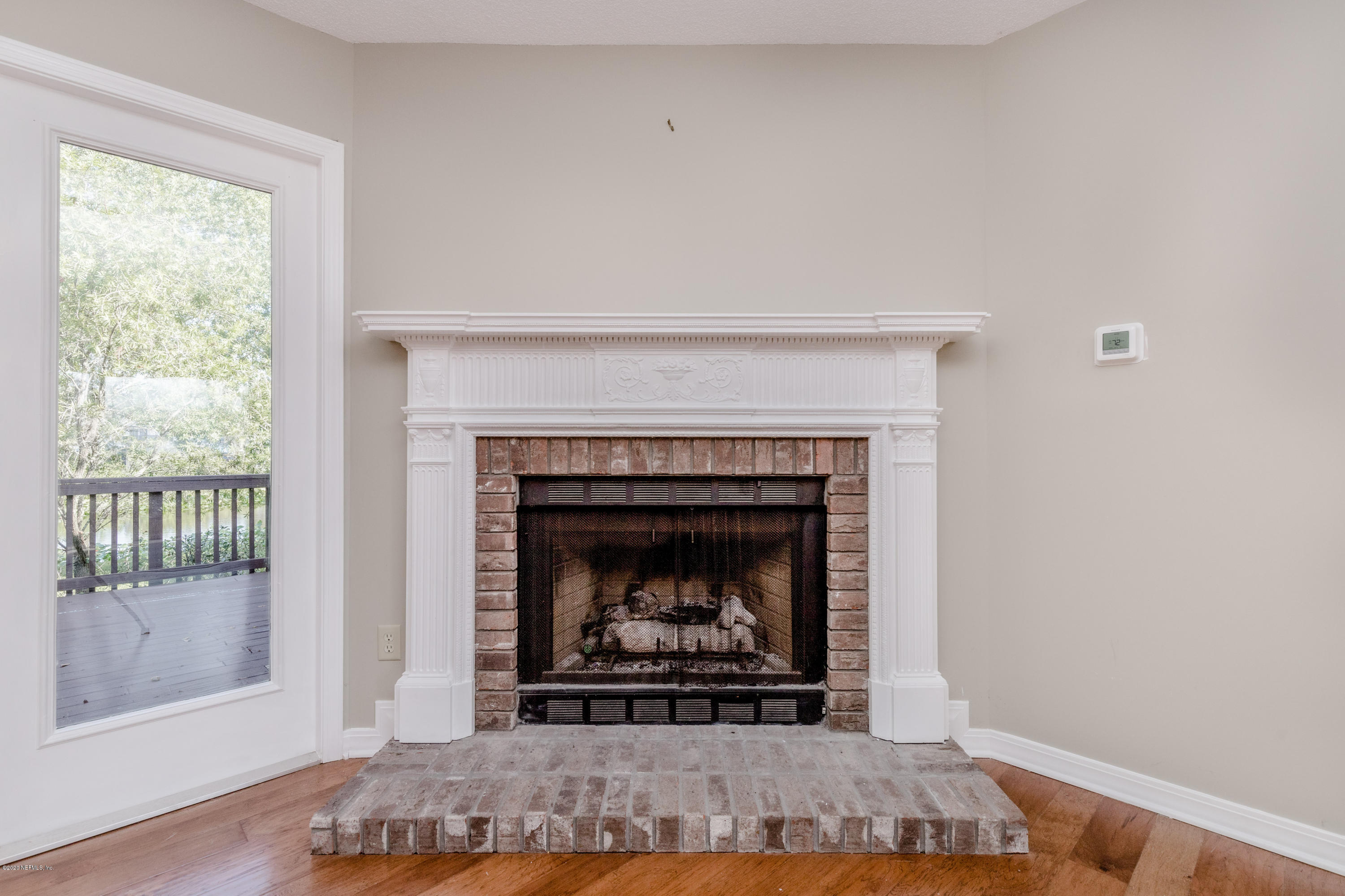 1704 Memory Lane Jacksonville, FL 32210 - Photo 8 of 54 a living room with a fireplace