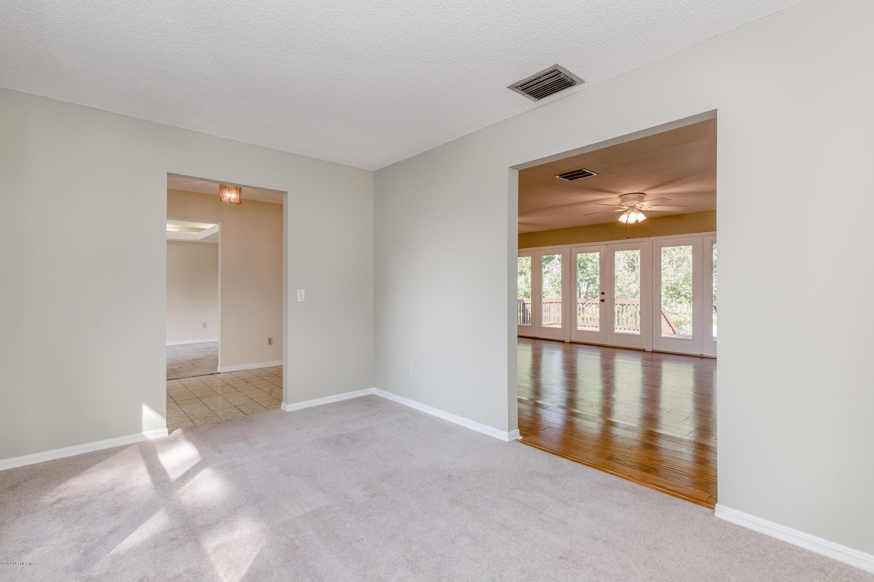 1704 Memory Lane Jacksonville, FL 32210 - Photo 9 of 54 a view of an empty room with glass door