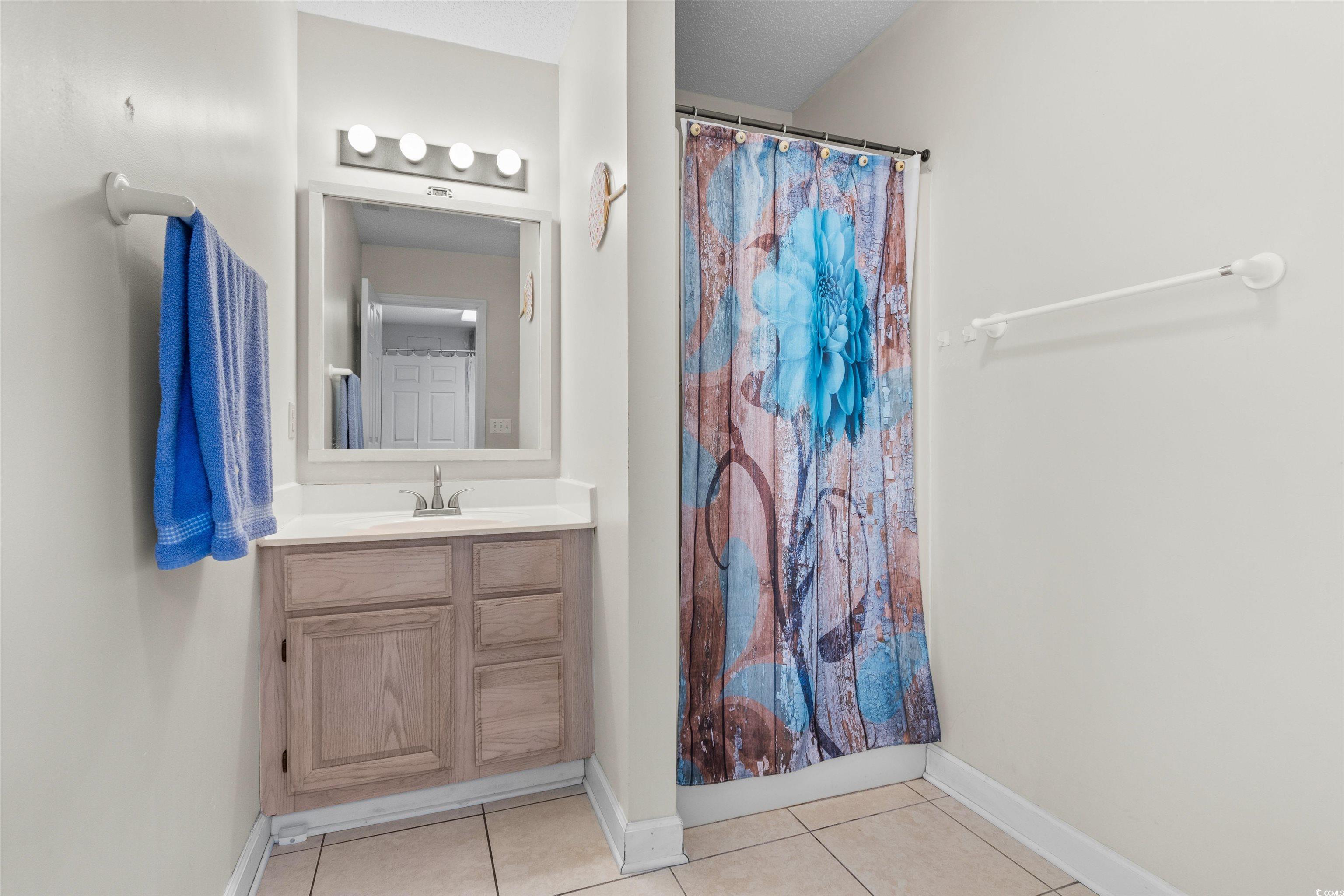 203 Prestwick Road Myrtle Beach, SC 29588 - Photo 21 of 34 Bedroom with light wood-type flooring and ceiling