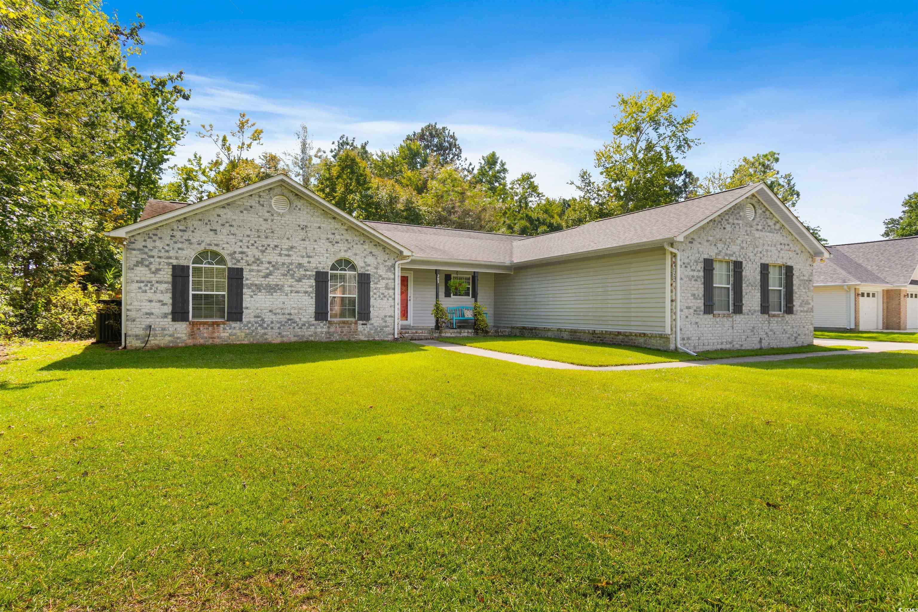 203 Prestwick Road Myrtle Beach, SC 29588 - Photo 29 of 34 View of front of home featuring a front lawn and a