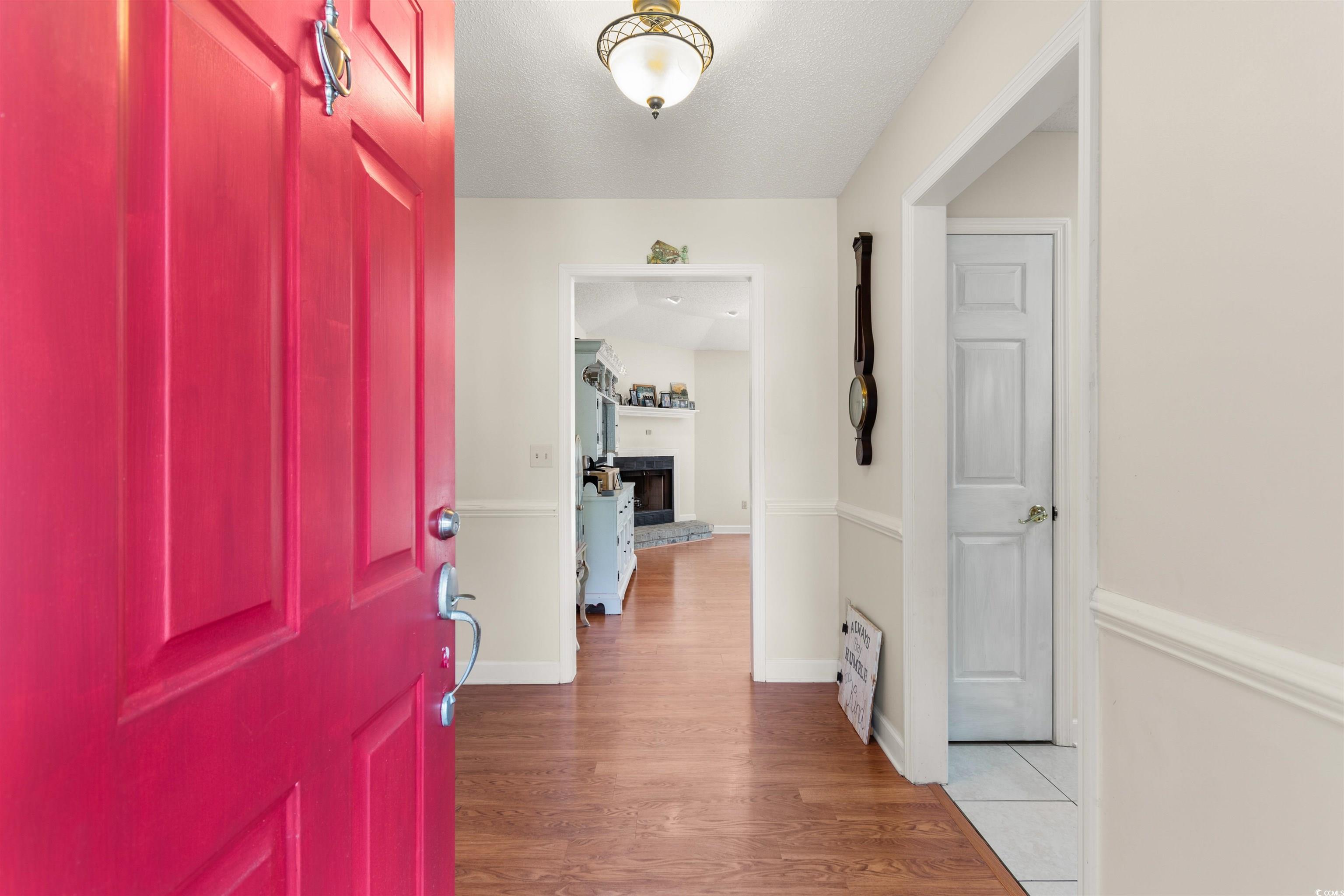 203 Prestwick Road Myrtle Beach, SC 29588 - Photo 3 of 34 Entrance foyer featuring a textured ceiling, wood-