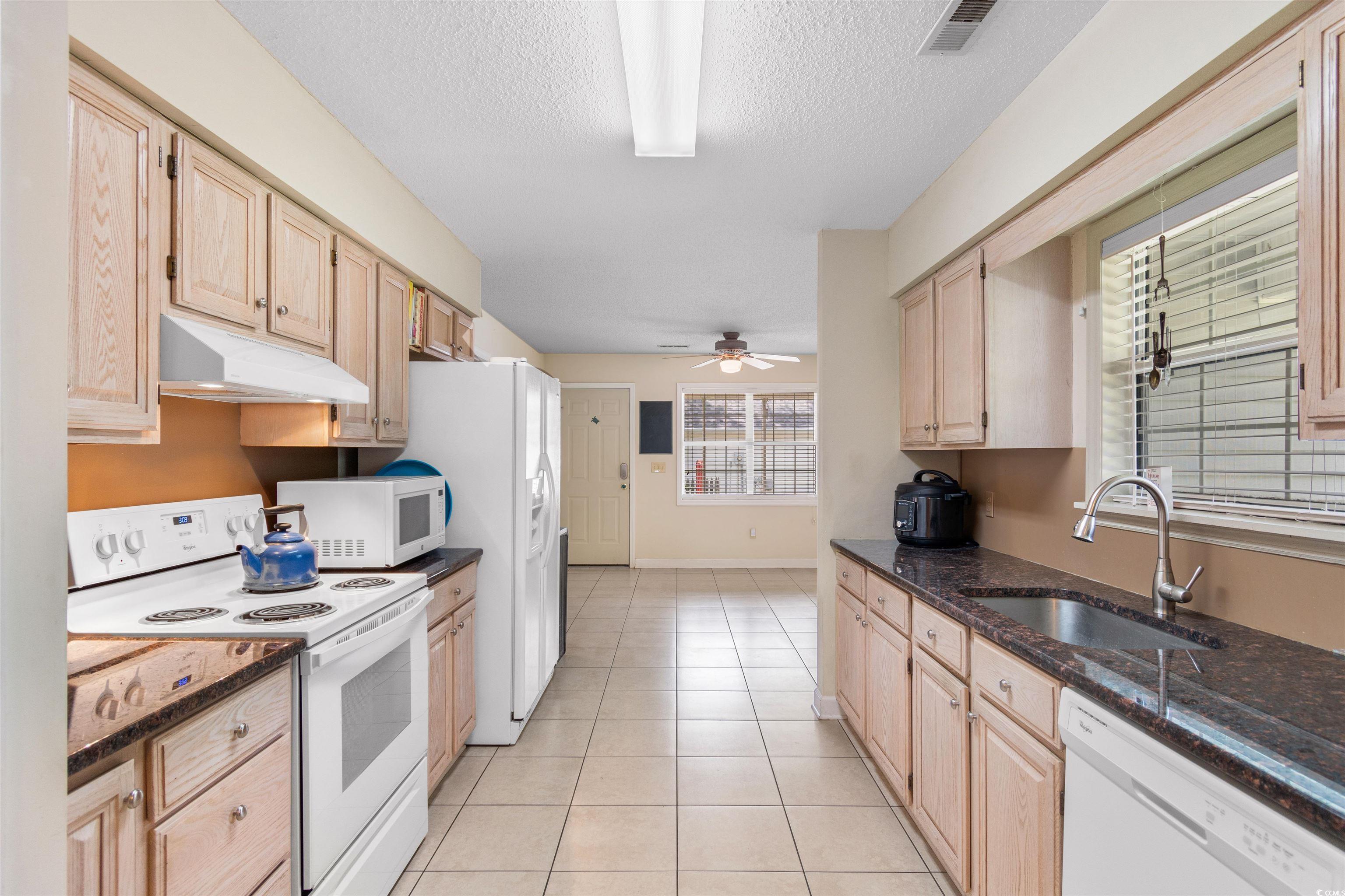 203 Prestwick Road Myrtle Beach, SC 29588 - Photo 6 of 34 Kitchen featuring white appliances, ceiling fan, s