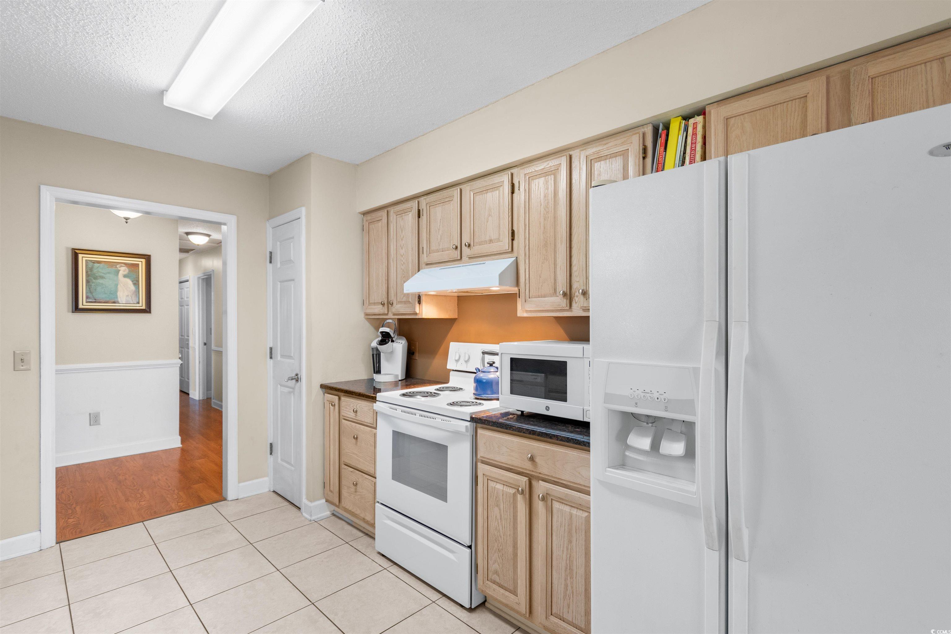 203 Prestwick Road Myrtle Beach, SC 29588 - Photo 7 of 34 Kitchen featuring light wood-type flooring, white