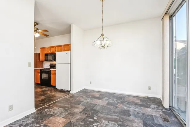a view of a kitchen with a sink and cabinets